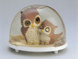 Close-Up of Figurines of a Pair of Owls in a Snow Globe