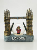 Close-Up of a Tower Bridge Shaped Snow Globe with a Figurine of a Beefeater