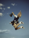 Cheerleader Jumping Holding Megaphone