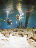 Couple Diving Underwater