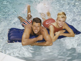 Couple on Raft in Pool