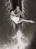 Couple Performs Waterskiing Stunt
