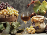 Close-Up of a Glass of Wine with a Bunch of Grapes