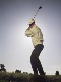 Young Golfer About to Hit Golf Ball on Tee