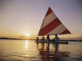 Family Sailing in Lake at Sunset