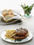 Close-Up of a Hamburger with Herbs and French Fries
