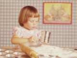 Girl Sifting Flour for Cupcakes