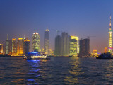 China, Shanghai, Night View of High Rises and Oriental Pearl TV Tower by Huangpu River