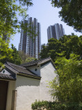 China, Hong Kong, Traditional Kejia People's House with Modern High Rise