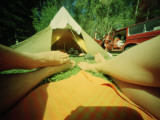 A Couple Relaxing Outside their Tent on a Vacation in Sweden