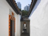 China, Hong Kong, Traditional Kejia People's House with Modern High Rise