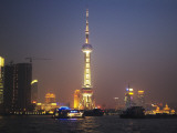 China, Shanghai, Night View of High Rises and Oriental Pearl TV Tower by Huangpu River