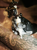 Close-Up of a Tattoo Artist Tattooing Himself Photographic Print