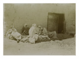 Travel in Algeria: Men Lying in a Street of Sidi Okba