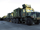 Buy Armored Trucks Sit on the Pier at Morehead City, North Carolina, Awaiting Deployment at AllPosters.com