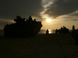 Buy Silhouette of Marines and an Amphibious Assault Vehicle on Hwajin Beach, Republic of Korea at AllPosters.com