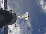 Buy Space Shuttle Atlantis and a Russian Spacecraft Backdropped by a Blue and White Earth at AllPosters.com