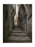A Muslim Woman Walking Down a Steep Stairway