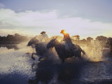 Argentine Gauchos Race across a Lake Near Beron De Astrada