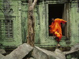 Buy A Monk Emerges from the Doorway of an Angkor Wat Temple at AllPosters.com