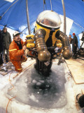 Buy A Scientist Uses a Submersible Suit to Search a Shipwreck at AllPosters.com