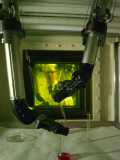 Buy A Man Uses Mechanical Hands to Handle Nuclear Materials at AllPosters.com