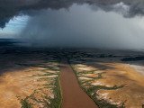 Buy Monsoon Rains over a Muddy River at AllPosters.com