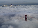 A Glowing Tower of the Golden Gate Bridge Rises Above the Fog