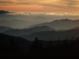 Buy Sunset Casts a Colorful Glow over Mountaintops Shrouded in Fog at AllPosters.com