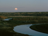 The Moon Rises over Low Hills Banking the Missouri River
