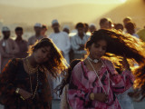 Dancers Swing their Hair at a Festival in Muscat