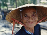 Buy An Elderly Vietnamese Woman in a Native Hat Smiles as She Is Photographed at AllPosters.com
