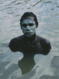 Aboriginal Teen with a Mask of Mud, Swimming in a Billabong