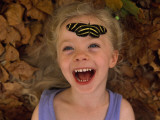 Buy Ellen Sartore with a Zebra Butterfly Resting on Her Forehead at AllPosters.com