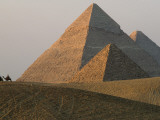 Buy Camel Riders are Dwarfed by the Pyramids of Giza at AllPosters.com