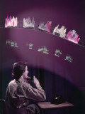 Buy A Woman Speaks in a Phone in a Room with Models of Voice Patterns at AllPosters.com