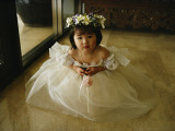 A Young Girl Attends a Wedding