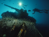 Buy Divers Explore the USS President Coolidge's Forward Guntub at AllPosters.com