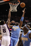 Buy Denver Nuggets v Phoenix Suns: Nene at AllPosters.com