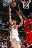 Chicago Bulls v Houston Rockets: Luis Scola and Luol Deng