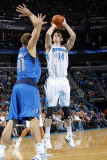 Dallas Mavericks v New Orleans Hornets: Jason Smith and Dirk Nowitzki