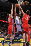 New Jersey Nets v Denver Nuggets: Nene, Kris Humpries and Brook Lopez