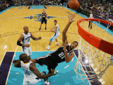 San Antonio Spurs v New Orleans Hornets: Tim Duncan and Emeka Okafor