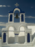 A Church Bell and Tower Against a Blue Sky