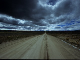 Buy Dark Storm Clouds over Dirt Road and Grasslands of Saskatchewan at AllPosters.com