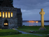A Celtic Cross Stands Outside the Iona Monastery Church at Dusk