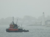 Buy A Tugboat Travels Through Fog Past New London Harbor Light at AllPosters.com
