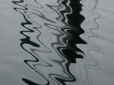 Abstract View of the Reflections of Pilings on Water