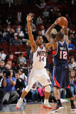 Atlanta Hawks v New Jersey Nets: Josh Powell and Derrick Favors