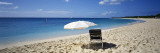 Single Beach Chair and Umbrella on Sand, Saint Martin, French West Indies